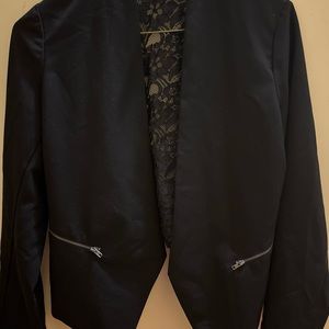 Black blazer with lace back.
